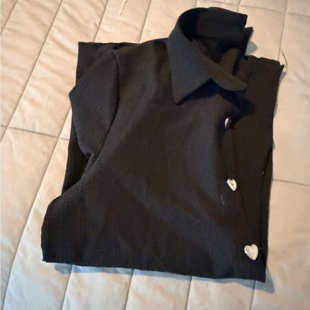 Black button up top with silver heart buttons.